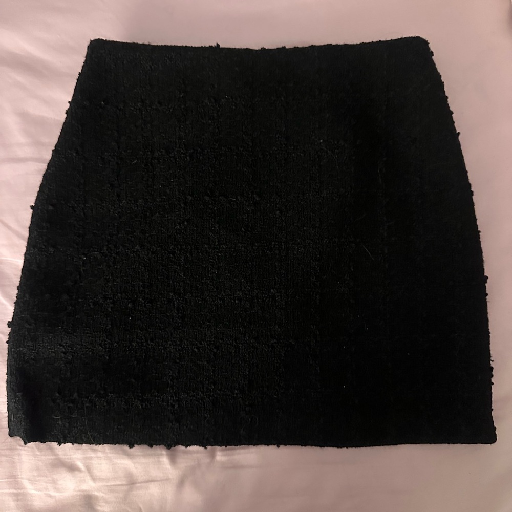 Short black textured mini skirt